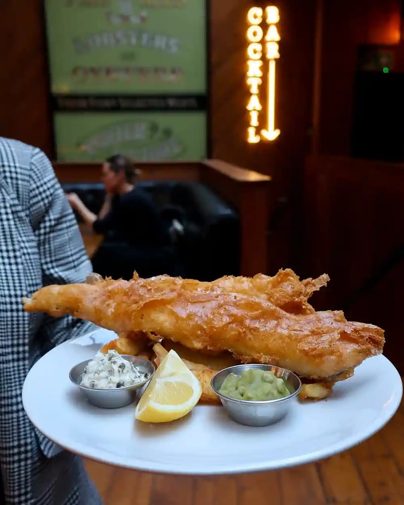 Crispy, golden, and timeless Fish and Chips. What more could you want? 😍🐟