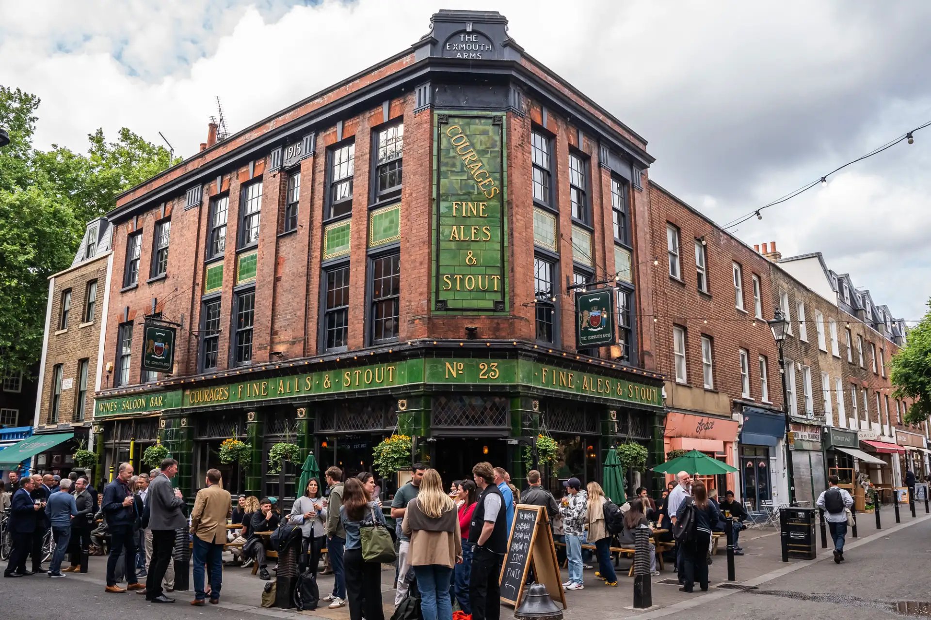 Victorian pub with a green-tiled facade, stained-glass windows and a large menu of bottled beers.